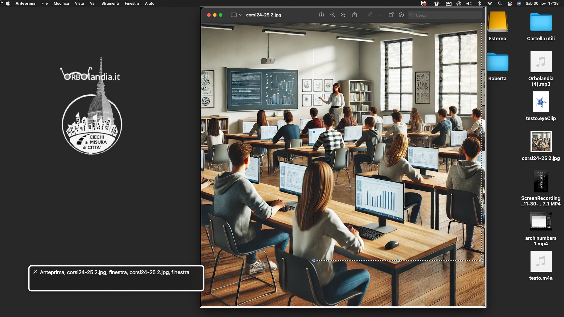 nell’immagine uno screenshot del Mac, a sinistra il logo di Orbolandia e a destra l’immagine di una classe moderna con allievi e docente